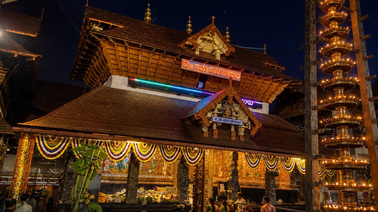 Guruvayur Sri Krishna Temple in Kerala during a major festival, with elephant processions and lamps