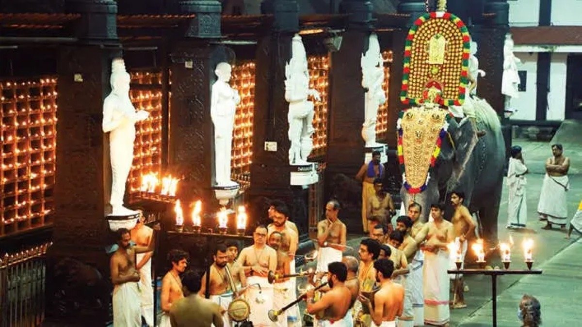 Vishu Kani arrangement with rice, fruits, gold, mirror and lamp before Lord Krishna at Guruvayur