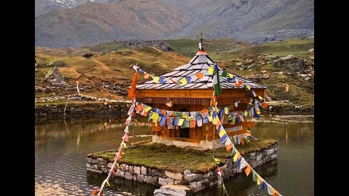 The small stone and deodar wood Krishna temple at Yulla Kanda, sitting on a rocky outcrop in the glacial lake