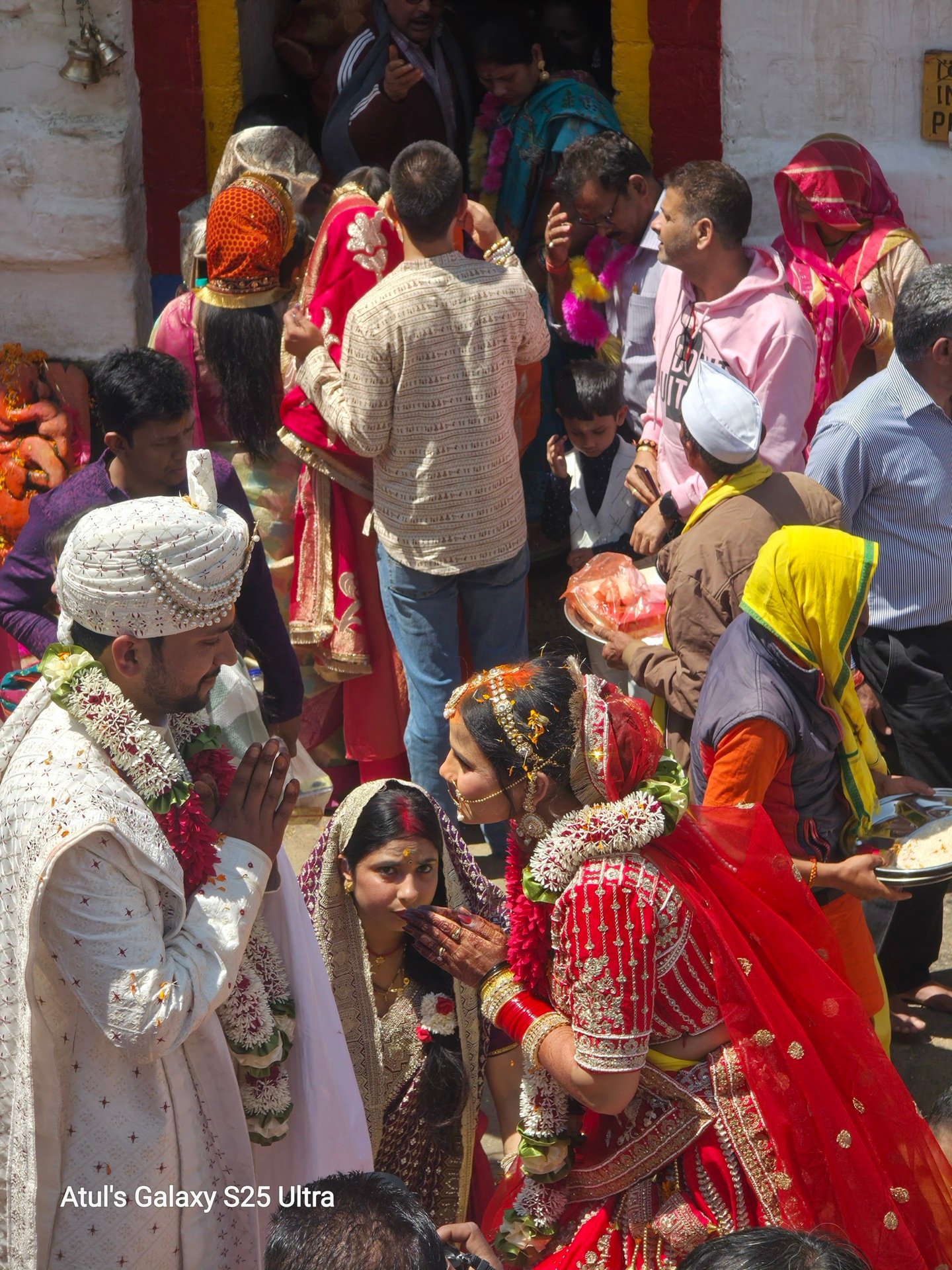 Bride and groom in traditional Pahari wedding procession at Triyuginarayan