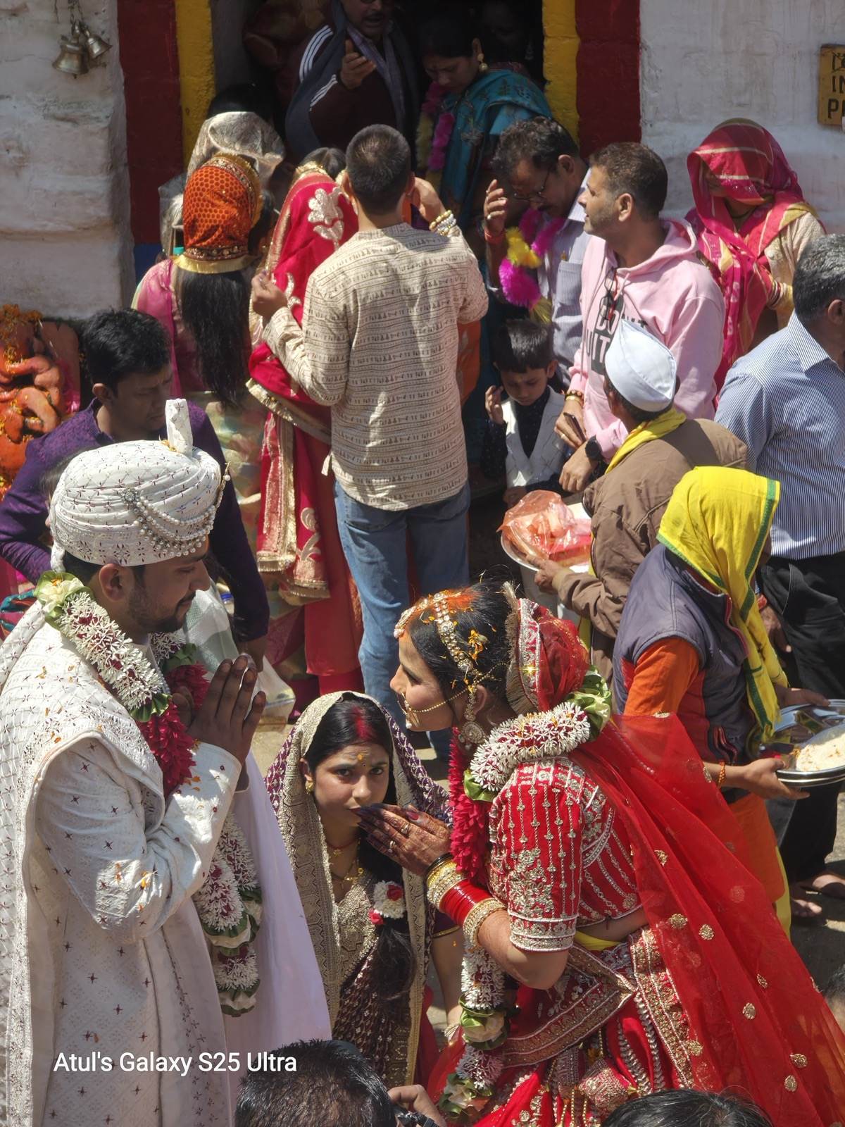 Bride and groom offering namaste after their wedding ceremony at Triyuginarayan Temple