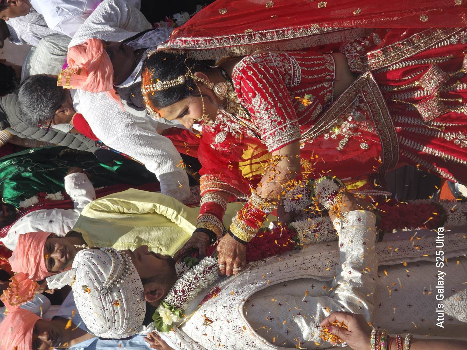 Bride and groom during the flower shower at a Triyuginarayan temple wedding