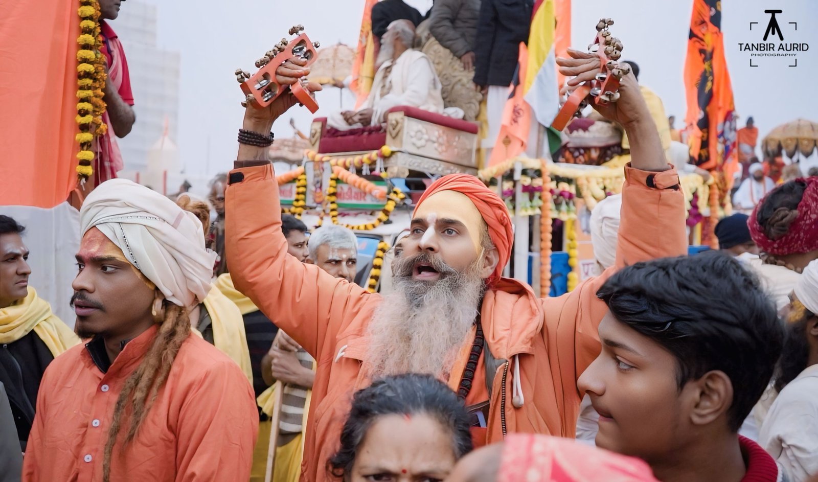 Sadhu with a damaru drum raised during the Shahi Snan procession