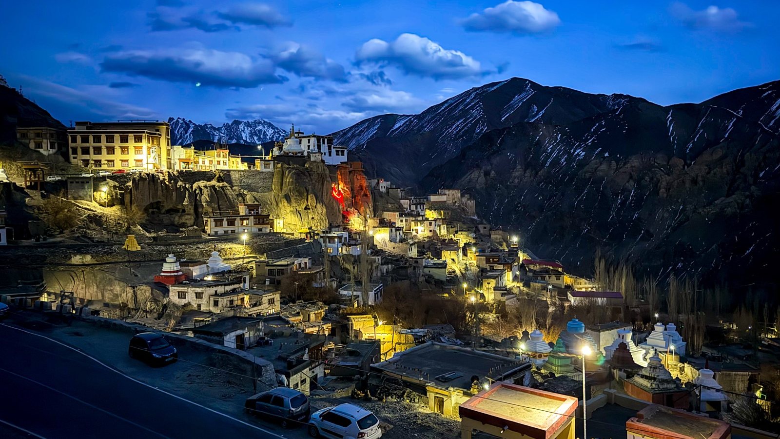 Leh town lit up after dark below the palace, Ladakh