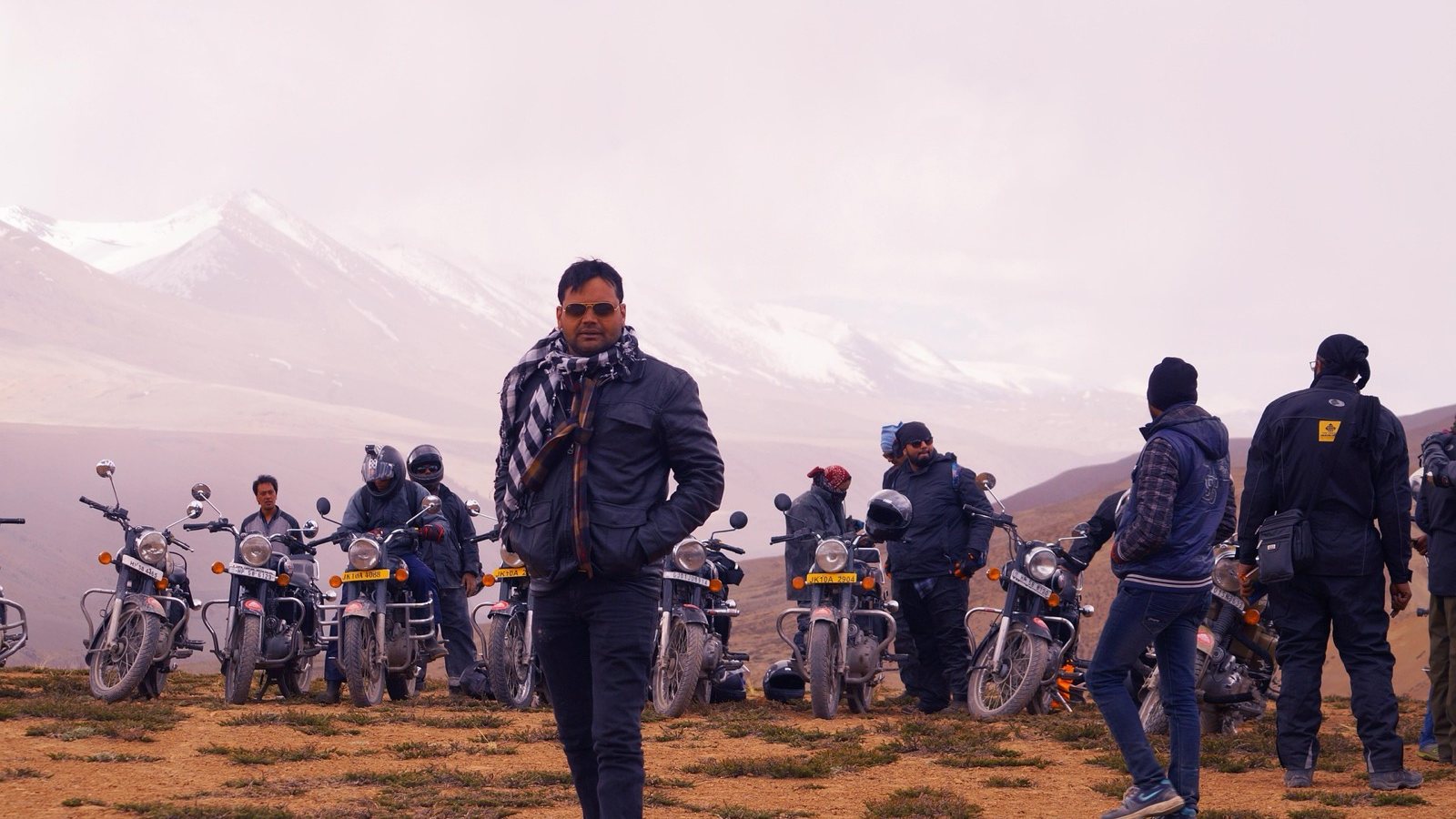 A group of riders stopped at a high pass in Ladakh