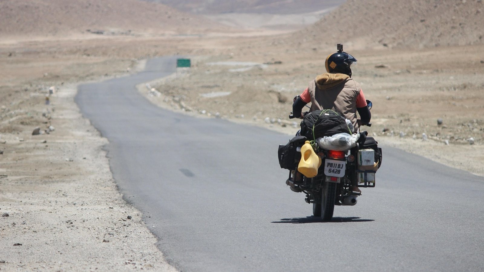 A motorcyclist alone on a Ladakh highway