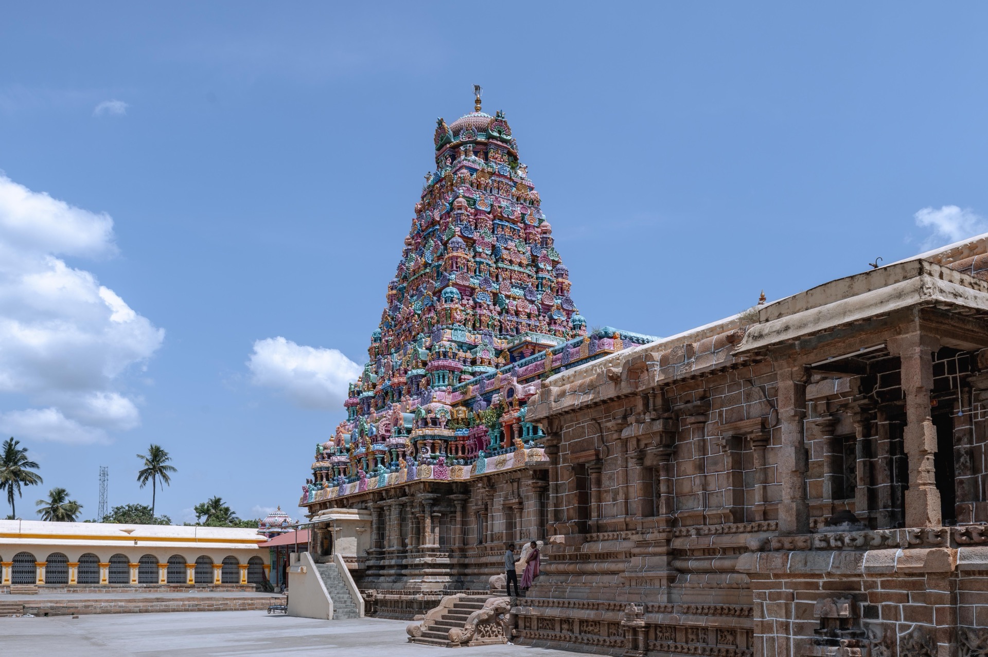 Painted gopuram and temple courtyard under a blue sky on the Pancha Bhoota Sthalam circuit